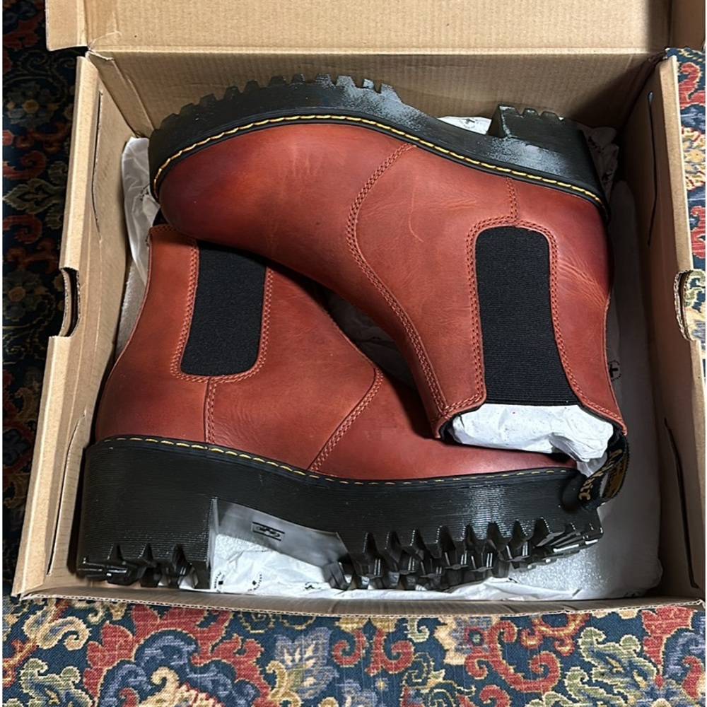 Never worn Dr Martens in style “Rometty Wyoming Leather Platform Chelsea Boots”